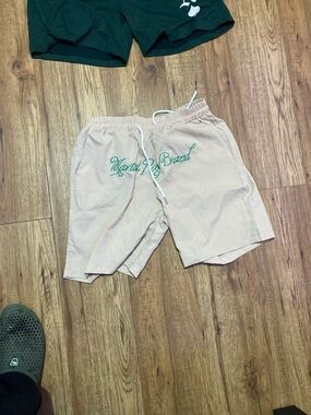 Beige Drawstring Shorts with Green Script Logo
